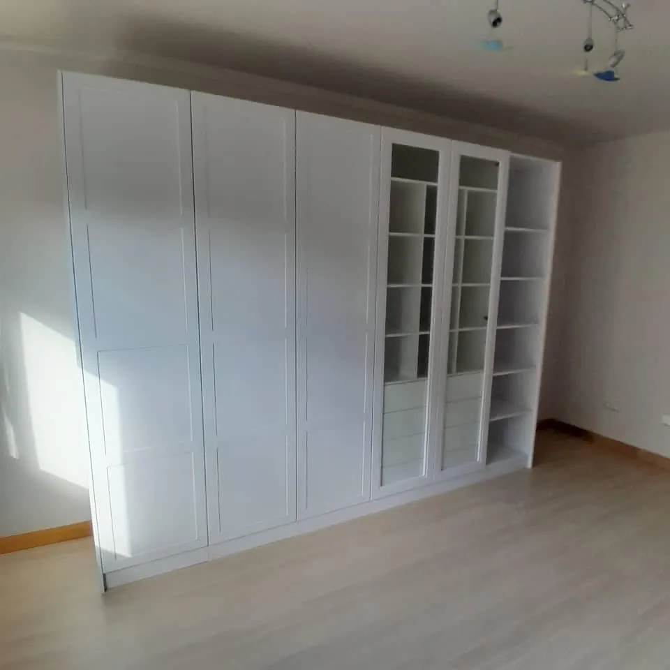 White hinged-door wardrobes, doors closed